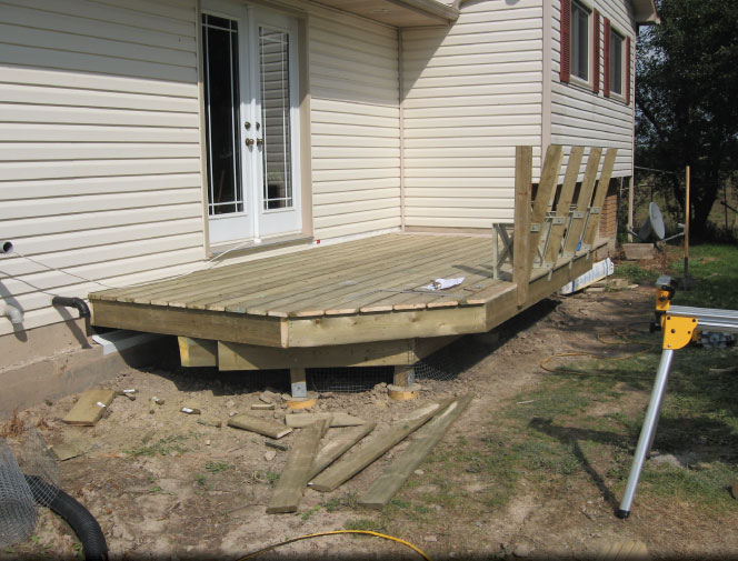 Deck boards are on and benches are started.